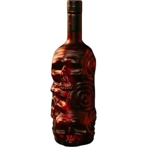 A dark glass bottle with an intricate carved skull and floral design on the front, filled with a deep red liquid, shown against a plain white background.