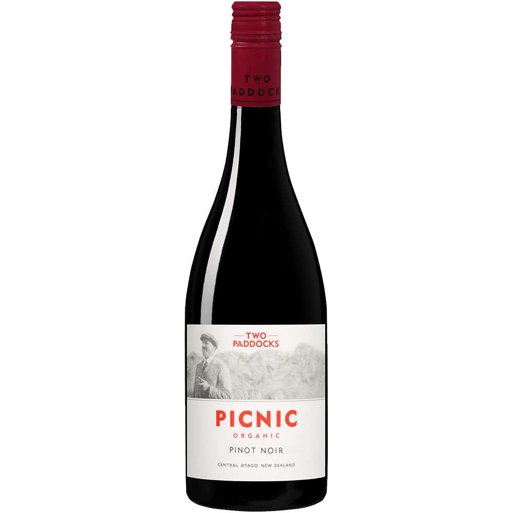 A bottle of Two Paddocks Picnic Organic Pinot Noir red wine against a solid green background.