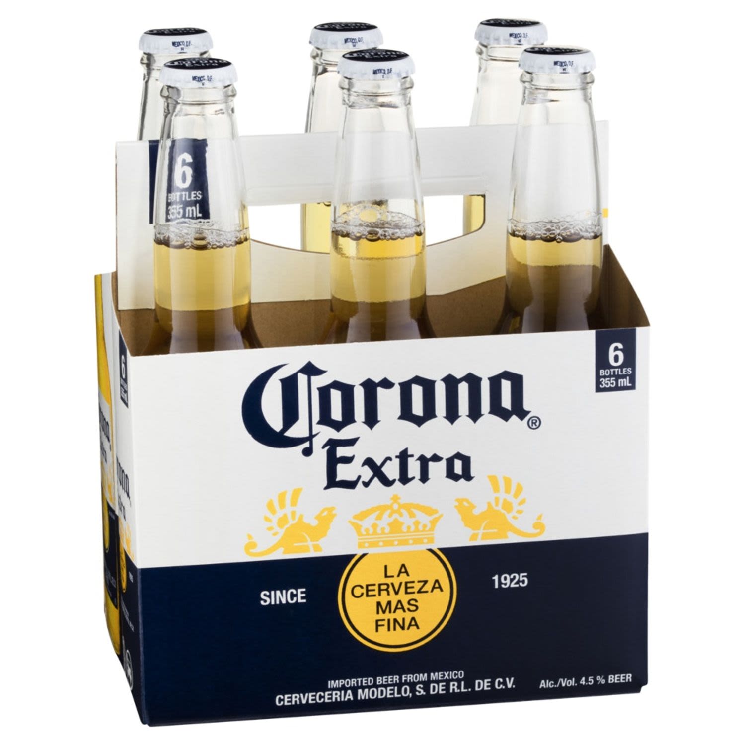 Six-pack of Corona Extra beer bottles in a cardboard holder on a white background