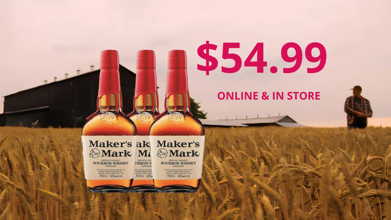 Three bottles of Maker's Mark bourbon with a price tag of $54.99 in a field.