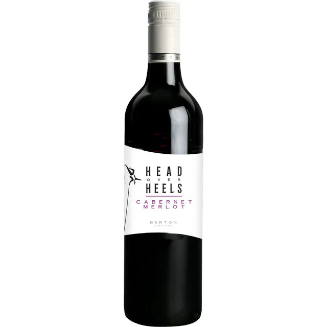 Red wine bottle with 'Head Over Heels' label on a white background