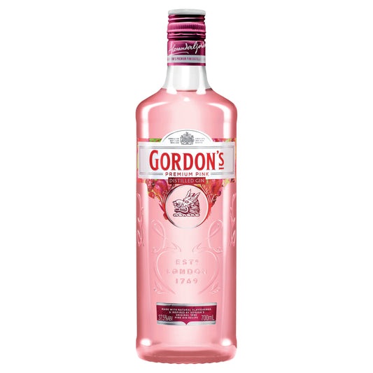 Pink bottle of Gordons Pink Gin on a white background