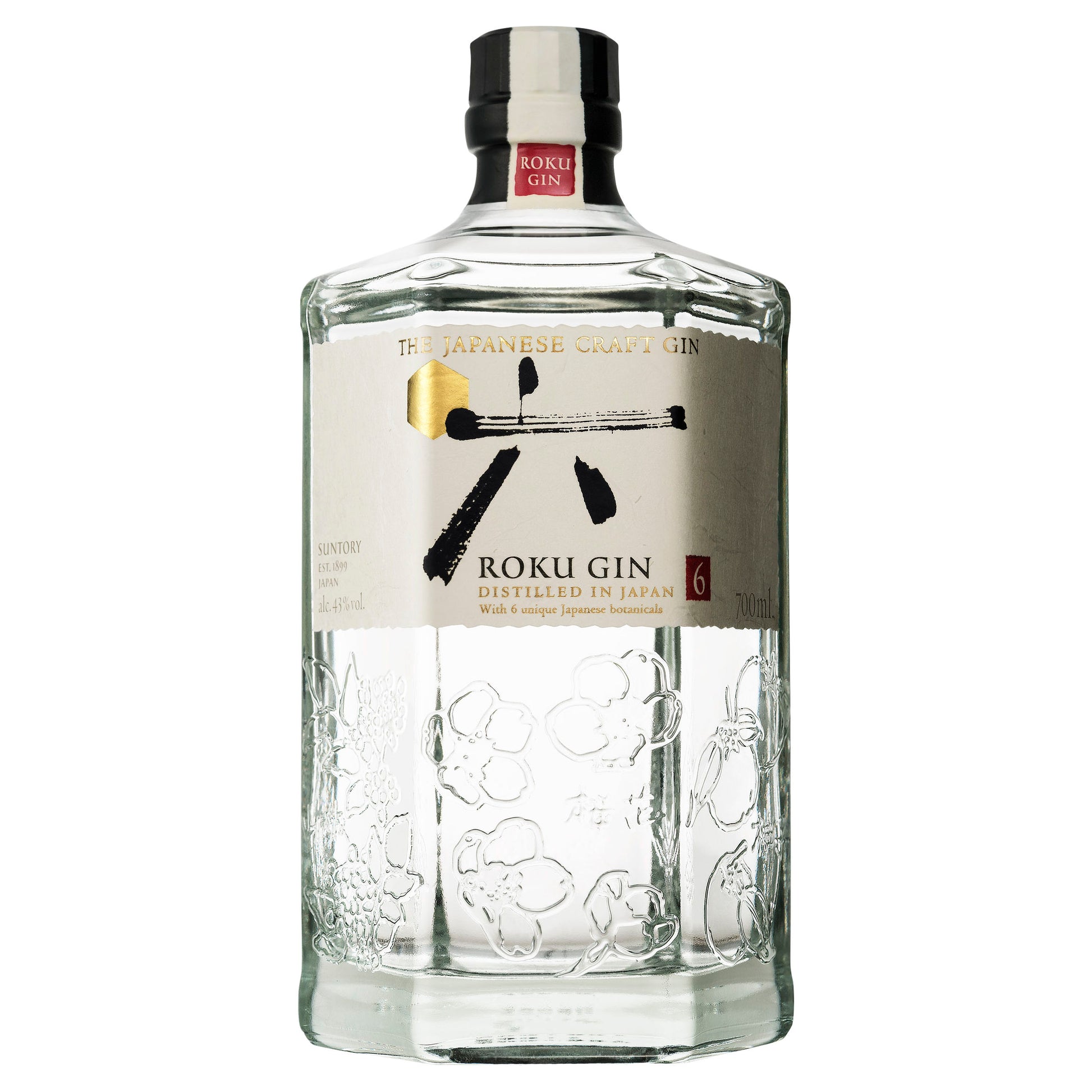 A clear glass bottle of Roku Gin with a label that features a stylized illustration of a wasabi root and the text 'Roku Gin' prominently displayed.