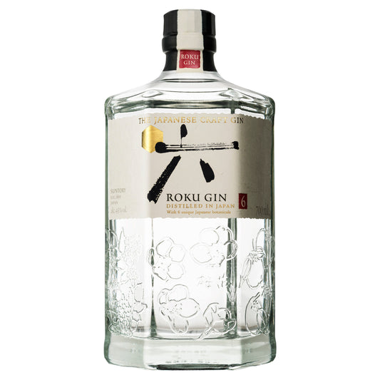 A clear glass bottle of Roku Gin with a label that features a stylized illustration of a wasabi root and the text 'Roku Gin' prominently displayed.